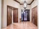 Elegant foyer with tile flooring, decorative lighting, and an ornate front door providing a grand entrance at 31721 N 138Th Pl, Scottsdale, AZ 85262