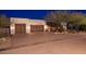Charming single-story home featuring a three-car garage, desert landscaping, and neutral-colored exterior paint at 31721 N 138Th Pl, Scottsdale, AZ 85262