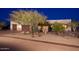 Charming single-story home featuring a three-car garage, desert landscaping, and neutral-colored exterior paint at 31721 N 138Th Pl, Scottsdale, AZ 85262
