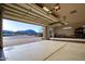 Spacious three-car garage with an open door and plenty of parking at 31721 N 138Th Pl, Scottsdale, AZ 85262