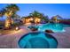 Inviting backyard pool with spa and mature palm trees at 31721 N 138Th Pl, Scottsdale, AZ 85262