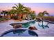 Relaxing backyard pool, waterfall feature, and desert landscaping at 31721 N 138Th Pl, Scottsdale, AZ 85262