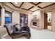 Comfortable seating area with a fireplace in the primary bedroom at 31721 N 138Th Pl, Scottsdale, AZ 85262