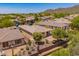 Desert home backyard with covered patio, low-maintenance landscaping, and wrought iron fence at 41227 N Rolling Green Way, Anthem, AZ 85086