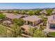 Desert home backyard with covered patio and manicured, low-maintenance landscaping at 41227 N Rolling Green Way, Anthem, AZ 85086