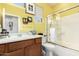 Bright bathroom with vanity, framed mirror and shower with glass door at 41227 N Rolling Green Way, Anthem, AZ 85086