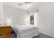 Bright bedroom with window, ceiling fan, and neutral color palette at 41227 N Rolling Green Way, Anthem, AZ 85086