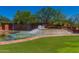 Anthem Country Club's water feature at the entrance, surrounded by lush greenery and a beautiful architectural design at 41227 N Rolling Green Way, Anthem, AZ 85086