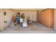 Spacious garage with cabinets and storage solutions at 41227 N Rolling Green Way, Anthem, AZ 85086