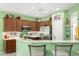 Modern kitchen with stainless steel appliances, breakfast bar, and ample counter space at 41227 N Rolling Green Way, Anthem, AZ 85086