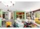 Cozy living area with built-in shelving, modern furnishings, and an open layout at 41227 N Rolling Green Way, Anthem, AZ 85086