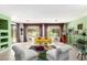 Bright open living room with lots of natural light and comfortable contemporary furnishings at 41227 N Rolling Green Way, Anthem, AZ 85086