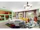 Spacious living room with colorful decor, comfortable seating and plenty of natural light at 41227 N Rolling Green Way, Anthem, AZ 85086