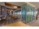 Elegant restaurant featuring a wine rack and multiple tables and chairs and views of golf course at 41227 N Rolling Green Way, Anthem, AZ 85086
