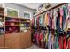 Spacious walk-in closet with custom shelving and ample storage space at 41227 N Rolling Green Way, Anthem, AZ 85086