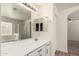 Bright bathroom showcases a bathtub and shower combination, vanity, and dual mirrors at 41251 W Cahill Dr, Maricopa, AZ 85138