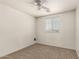 Bedroom featuring neutral carpeting and a bright window with blinds at 41251 W Cahill Dr, Maricopa, AZ 85138