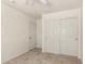 Bedroom featuring neutral carpeting and a closet with sliding doors at 41251 W Cahill Dr, Maricopa, AZ 85138
