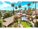 Aerial view of property with pool, landscaping and palm trees at 4200 N Miller Rd # 408, Scottsdale, AZ 85251