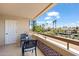 Balcony features seating and views of palm trees at 4200 N Miller Rd # 408, Scottsdale, AZ 85251