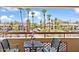 Balcony with seating and views of palm trees and the city at 4200 N Miller Rd # 408, Scottsdale, AZ 85251