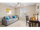 Bedroom with a cozy sofa, a wooden desk, and a ceiling fan at 4200 N Miller Rd # 408, Scottsdale, AZ 85251