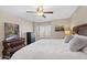 Inviting bedroom with a ceiling fan, a desert view, and an inviting queen bed at 4200 N Miller Rd # 408, Scottsdale, AZ 85251