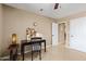 Bedroom with a desk, ceiling fan, and adjacent closet at 4200 N Miller Rd # 408, Scottsdale, AZ 85251