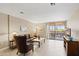 Bright living room offering comfortable seating, a center table, and a view of the balcony at 4200 N Miller Rd # 408, Scottsdale, AZ 85251