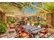 Charming outdoor seating area with shaded pergola, dining tables, and views of manicured grounds at 4200 N Miller Rd # 408, Scottsdale, AZ 85251