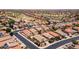 Aerial view of a neighborhood featuring well-maintained houses with desert landscaping at 42076 W Colby Dr, Maricopa, AZ 85138