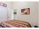 Bedroom with comfortable bed, ceiling fan, and decorations create a relaxing space at 42076 W Colby Dr, Maricopa, AZ 85138