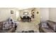Open-concept dining area with an elegant chandelier, stylish décor, and ample seating at 42076 W Colby Dr, Maricopa, AZ 85138