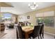 Inviting dining area with seating for six, connecting to the living room at 42076 W Colby Dr, Maricopa, AZ 85138