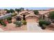 Charming single-story home with desert landscaping and a neutral color scheme at 42076 W Colby Dr, Maricopa, AZ 85138