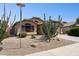Charming home with desert landscaping, mature trees, and well-manicured yard at 42076 W Colby Dr, Maricopa, AZ 85138