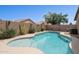 Backyard pool surrounded by desert landscaping providing a private and relaxing space at 42076 W Colby Dr, Maricopa, AZ 85138