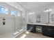 Bright bathroom featuring a glass-enclosed shower, double vanity, and modern fixtures at 4346 S Synapse Dr, Mesa, AZ 85212