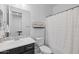 Well-lit bathroom with a vanity and a shower/tub with a clean, white shower curtain at 4346 S Synapse Dr, Mesa, AZ 85212