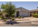 Charming single-story home with a two-car garage and well-maintained front yard landscaping at 4346 S Synapse Dr, Mesa, AZ 85212