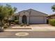 Attractive single-story home with a two-car garage, featuring desert landscaping and a welcoming entrance at 4346 S Synapse Dr, Mesa, AZ 85212