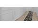 Hallway featuring decorative wood molding and a patterned area rug on light wood floors at 4346 S Synapse Dr, Mesa, AZ 85212