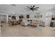 Open-concept living space with farmhouse decor, seamlessly connecting the living, dining, and kitchen areas at 4346 S Synapse Dr, Mesa, AZ 85212