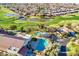 An aerial view showcases the community clubhouse with pools, tennis courts, and a golf course at 4524 E Narrowleaf Dr, Gilbert, AZ 85298