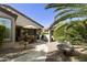 Expansive backyard with multiple seating areas, lush greenery, and desert landscaping at 4524 E Narrowleaf Dr, Gilbert, AZ 85298