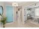 Inviting foyer featuring a blue front door and a view into the adjacent office space at 4524 E Narrowleaf Dr, Gilbert, AZ 85298
