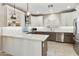 Modern kitchen with stylish white cabinets, stainless steel appliances, and a beautiful backsplash at 4524 E Narrowleaf Dr, Gilbert, AZ 85298