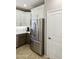Kitchen featuring stainless steel appliances, white upper cabinets, gray lower cabinets, and modern countertops at 4524 E Narrowleaf Dr, Gilbert, AZ 85298