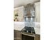 Modern kitchen featuring a sleek cooktop, decorative backsplash, and built-in cabinetry at 4524 E Narrowleaf Dr, Gilbert, AZ 85298