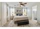 Serene bedroom with a ceiling fan, neutral color palette, and large windows with shutter blinds at 4524 E Narrowleaf Dr, Gilbert, AZ 85298